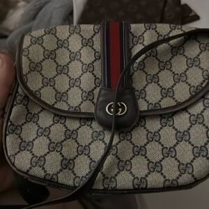 Vintage Gucci hand bag been used not in perfect condition but still a nice bag .